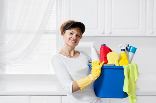 Professional upholstery cleaning equipment used on a fabric armchair